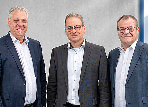 Gruppenbild der drei Personen der Geschäftsführung von Streck Transport mit Bernd Schäfer, Gerald Penner und Ralph Diringer
